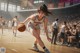 A woman dribbling a basketball on a basketball court.