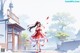 A woman in a red and white dress is walking down a street.
